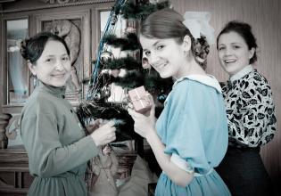
		Black and white photo of a family celebrating Christmas
	